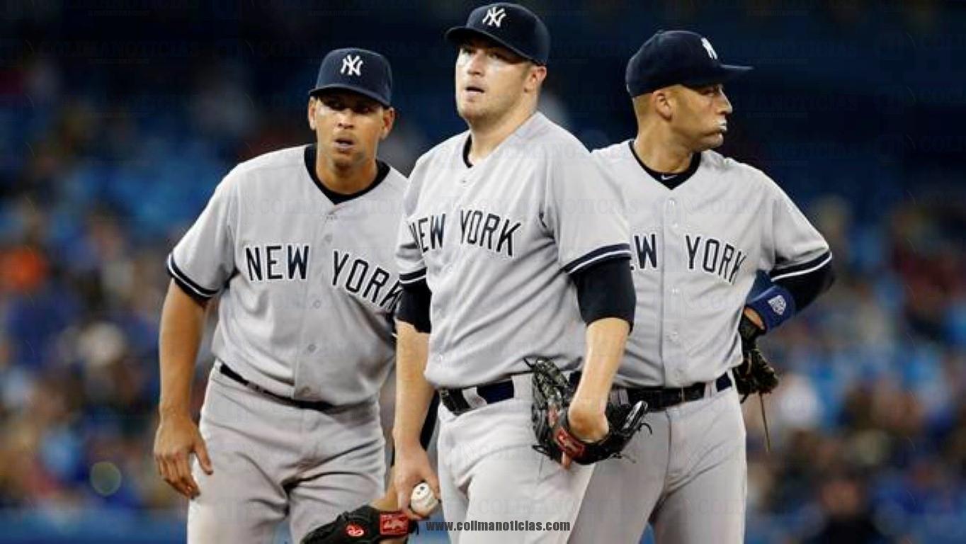 Yankees' Hughes, Rodriguez and Jeter stand on the mound during a break in play against the Blue Jays in the fifth inning of their MLB American League baseball game in Toronto