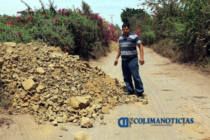 reparan camino el alto en armería